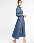 Woman wearing a blue dress on a white background