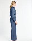 Woman wearing a blue denim outfit on a white background