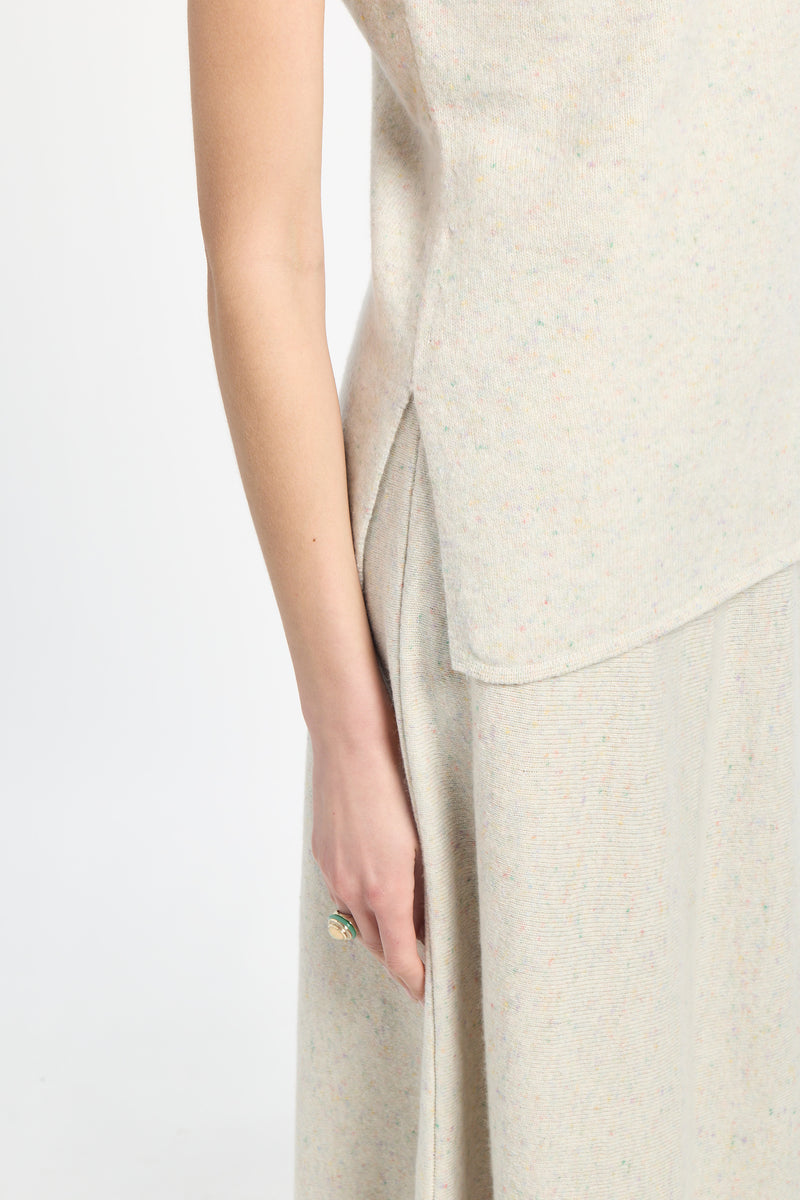 Beige sleeveless top and pants on a white background