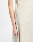 Beige sleeveless top and pants on a white background