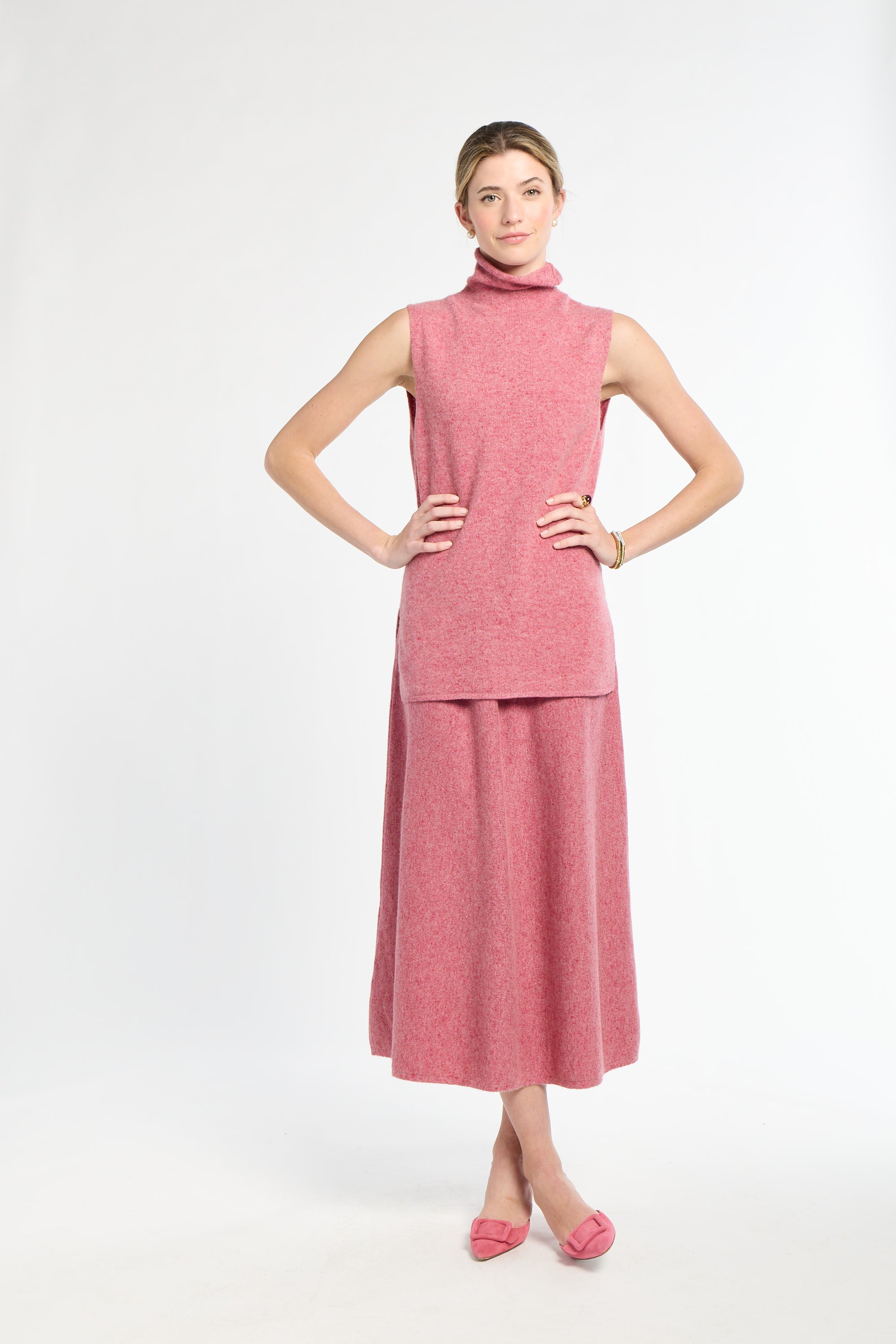 Woman wearing a pink dress on a white background