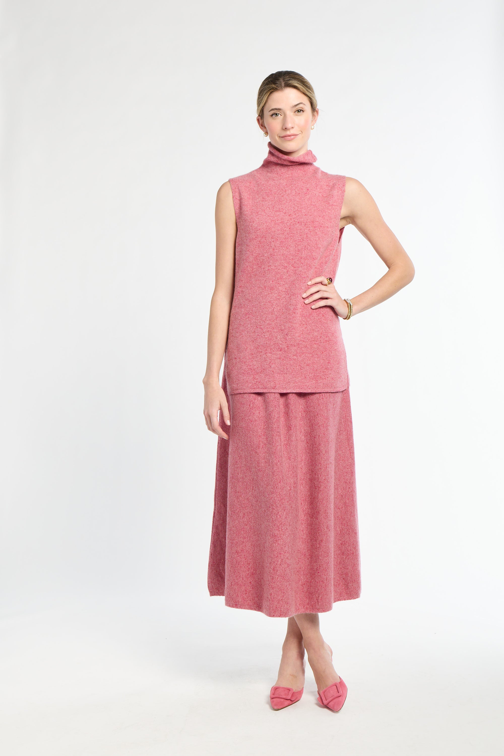 Woman wearing a pink dress on a white background