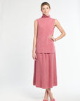 Woman wearing a pink dress on a white background