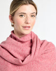 Woman wearing a pink scarf on a white background
