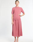 Woman wearing a pink outfit on a white background