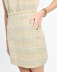 Woman wearing tweed mini skirt on a white background