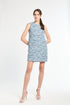 Woman wearing a blue tweed dress on a white background