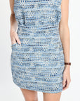 Close up of blue tweed mini skirt on a white background