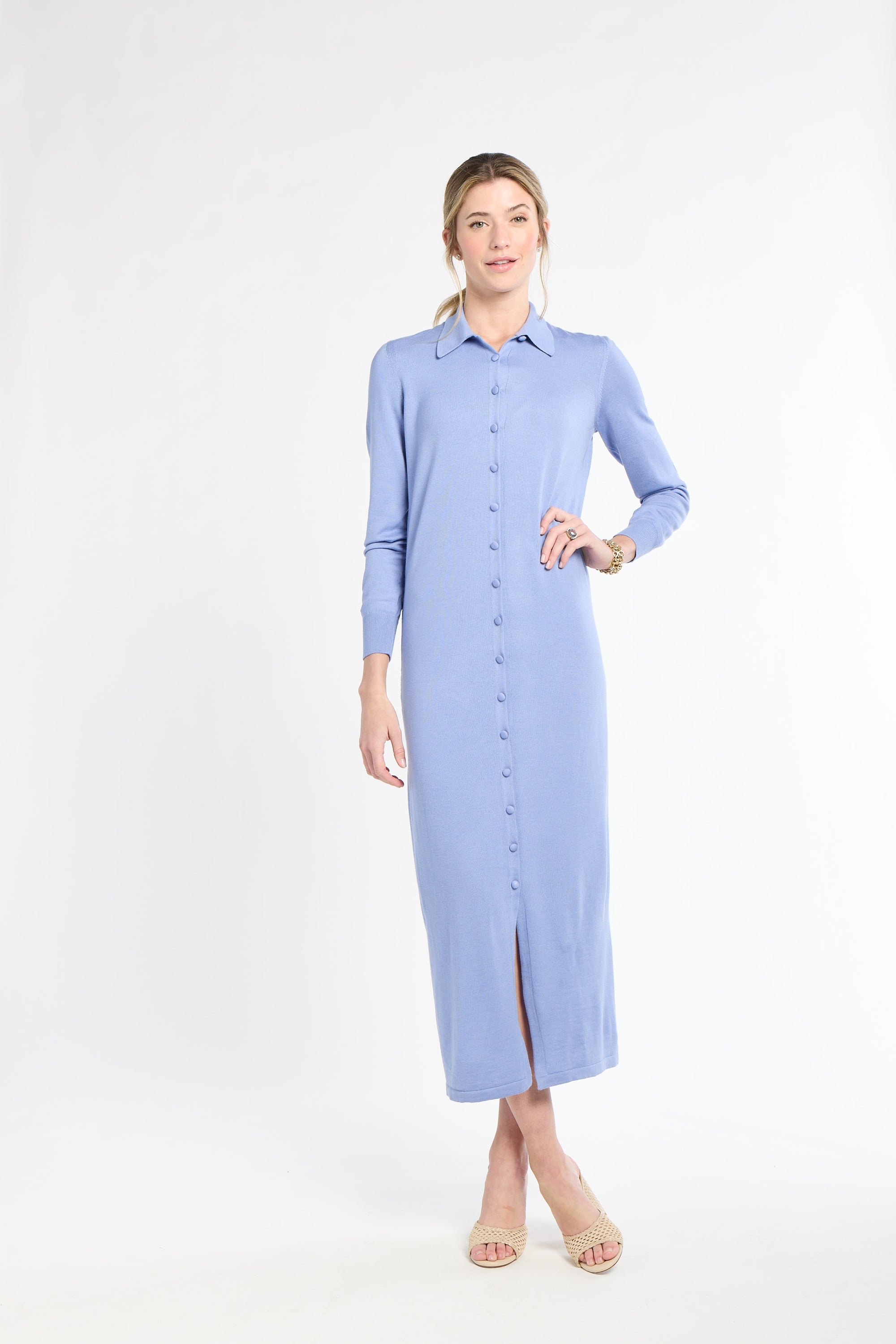 Woman wearing a light blue dress on a white background