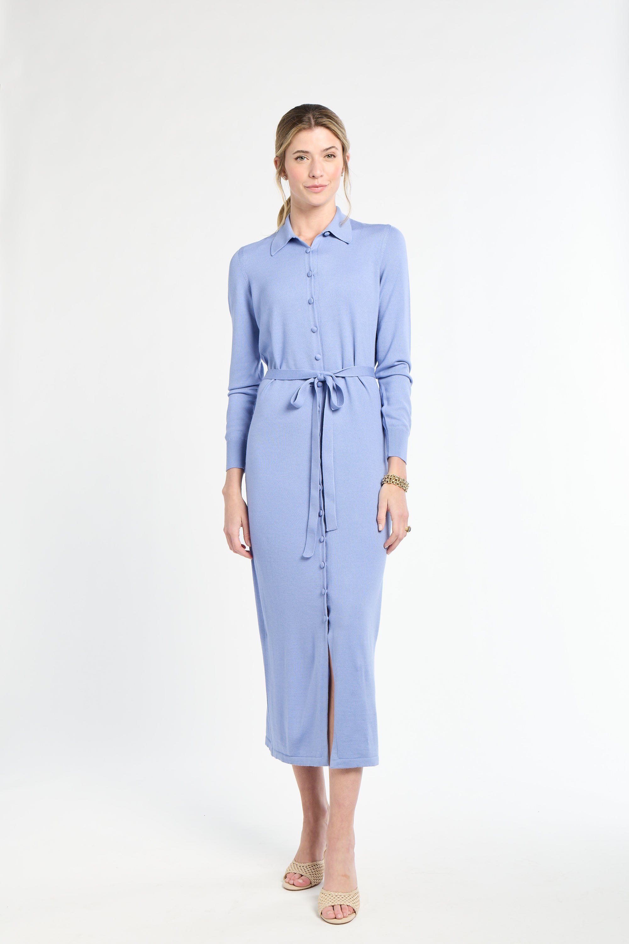 Woman wearing a light blue dress on a white background