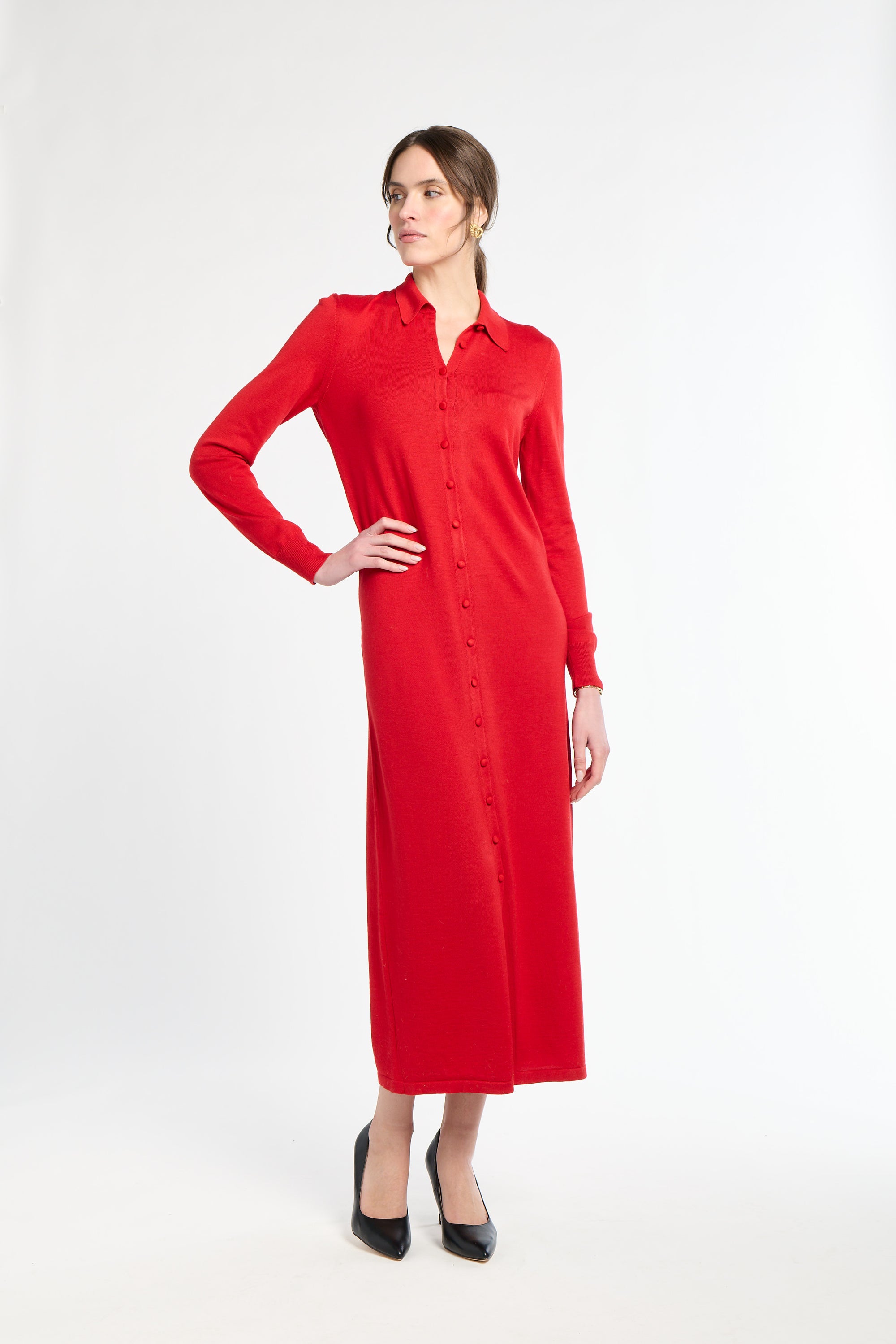 Woman wearing a red dress on a white background