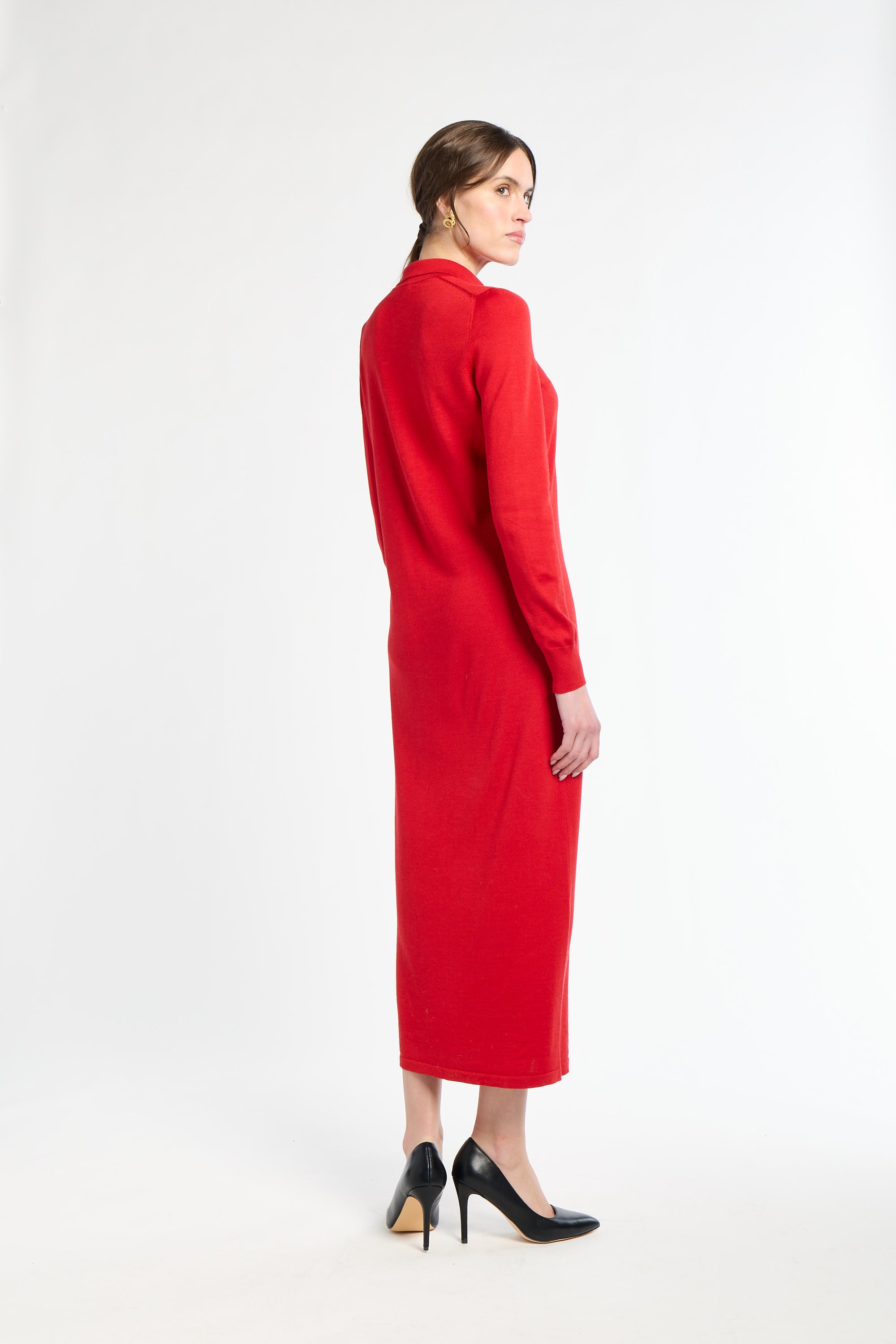 Woman wearing a red dress on a white background