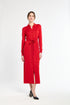 Woman wearing a red dress with a belt on a white background