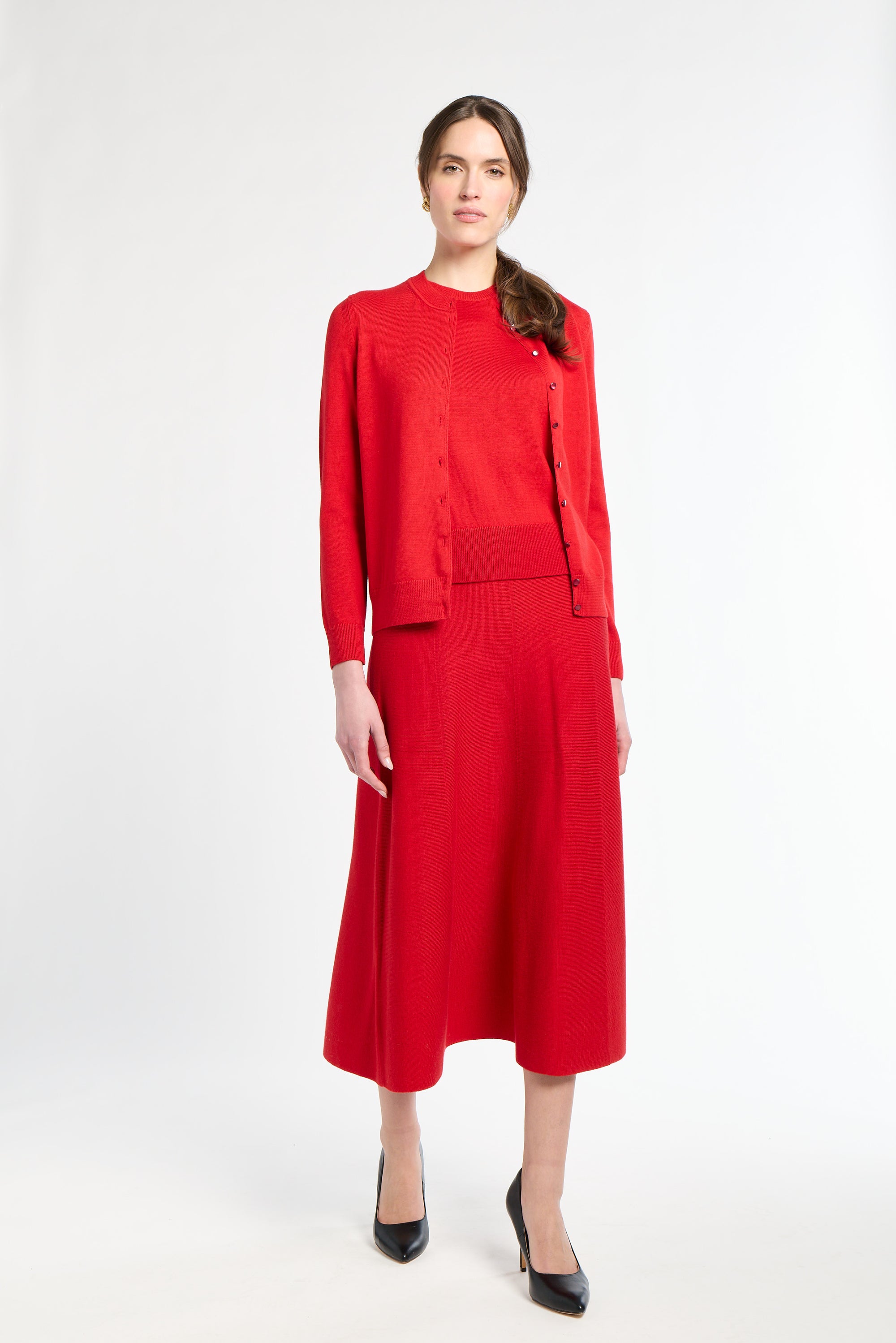 Woman wearing a red outfit on a white background