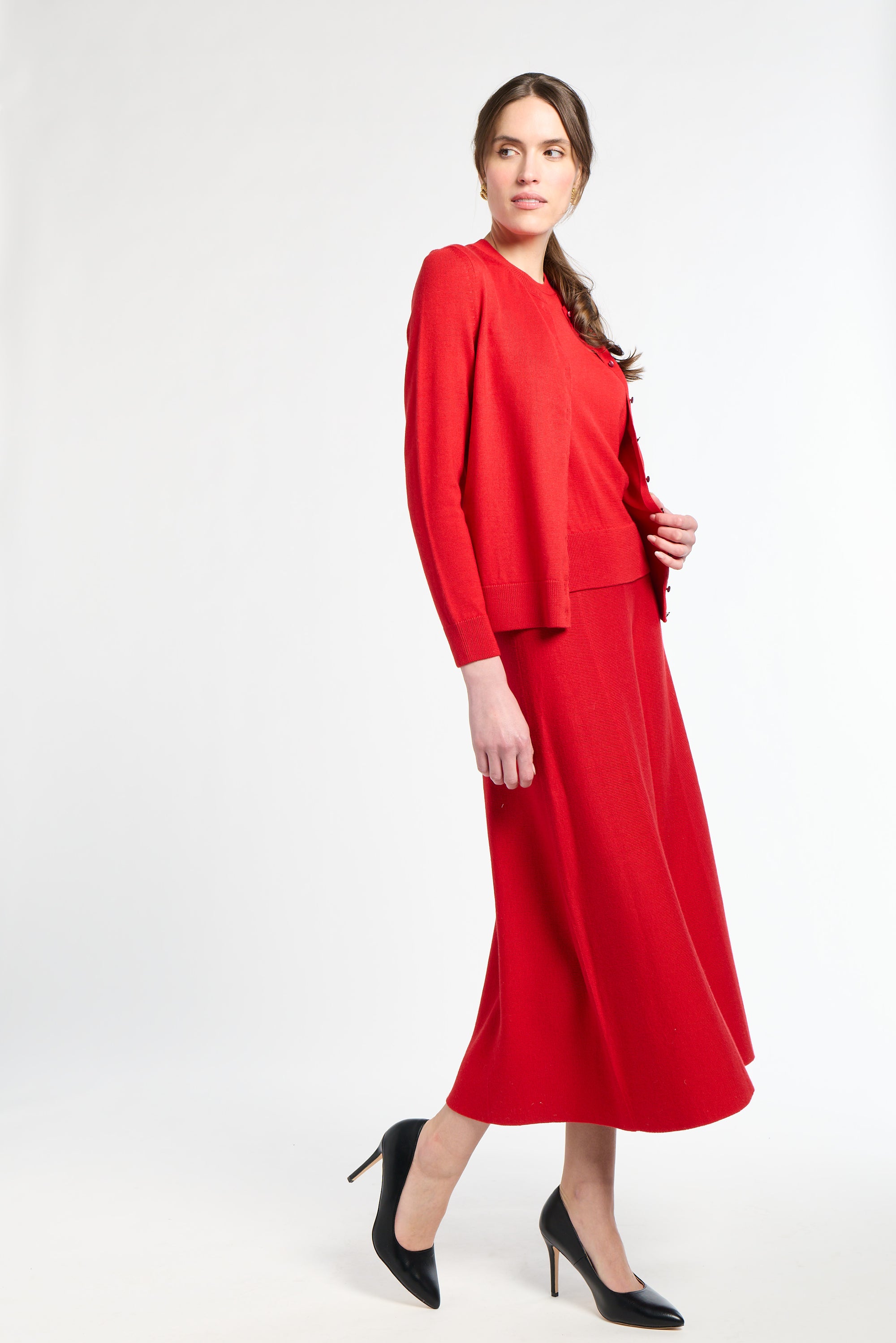 Woman wearing a red outfit on a white background