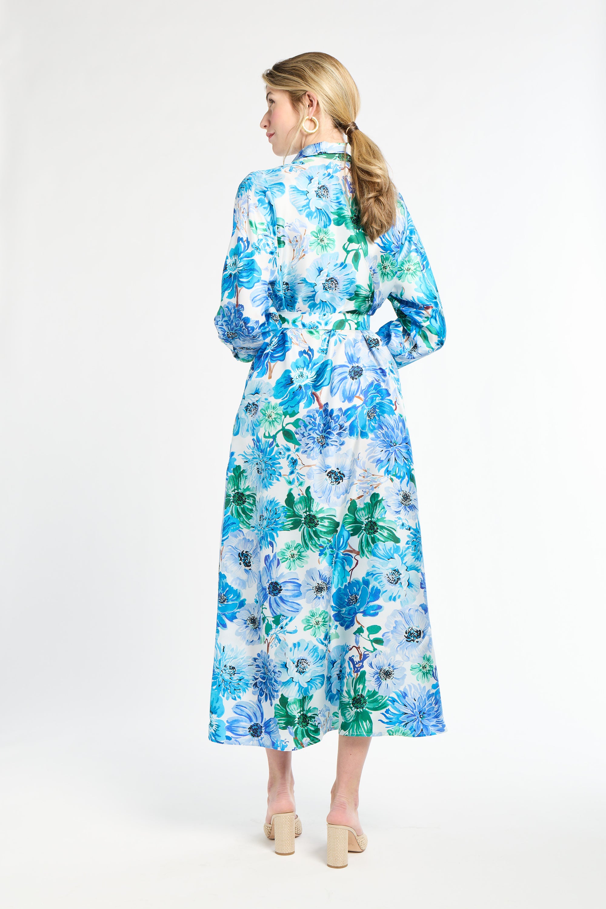 Woman wearing a floral dress with a white background