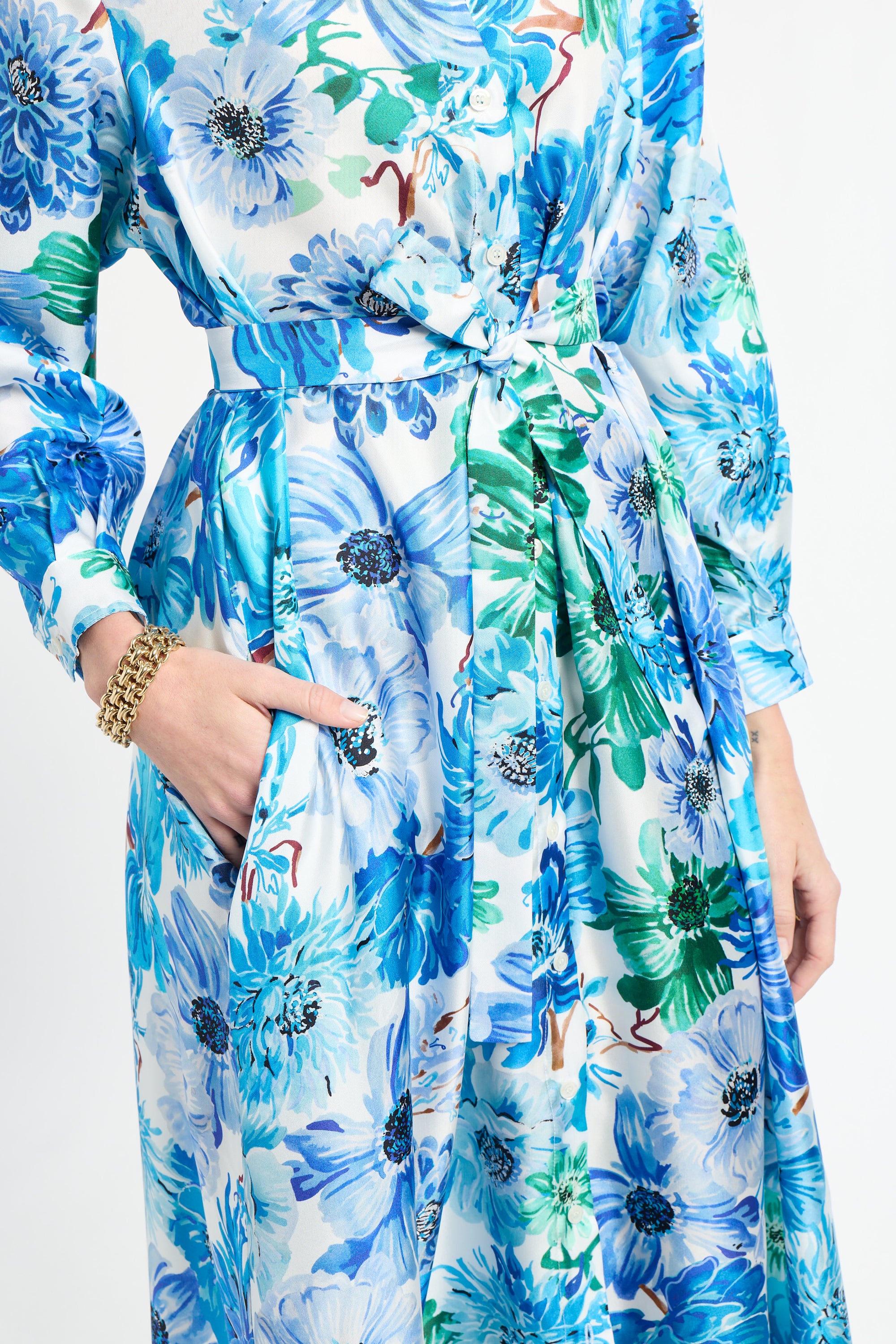 Floral dress with blue and green flowers on a white background