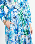 Floral dress with blue and green flowers on a white background