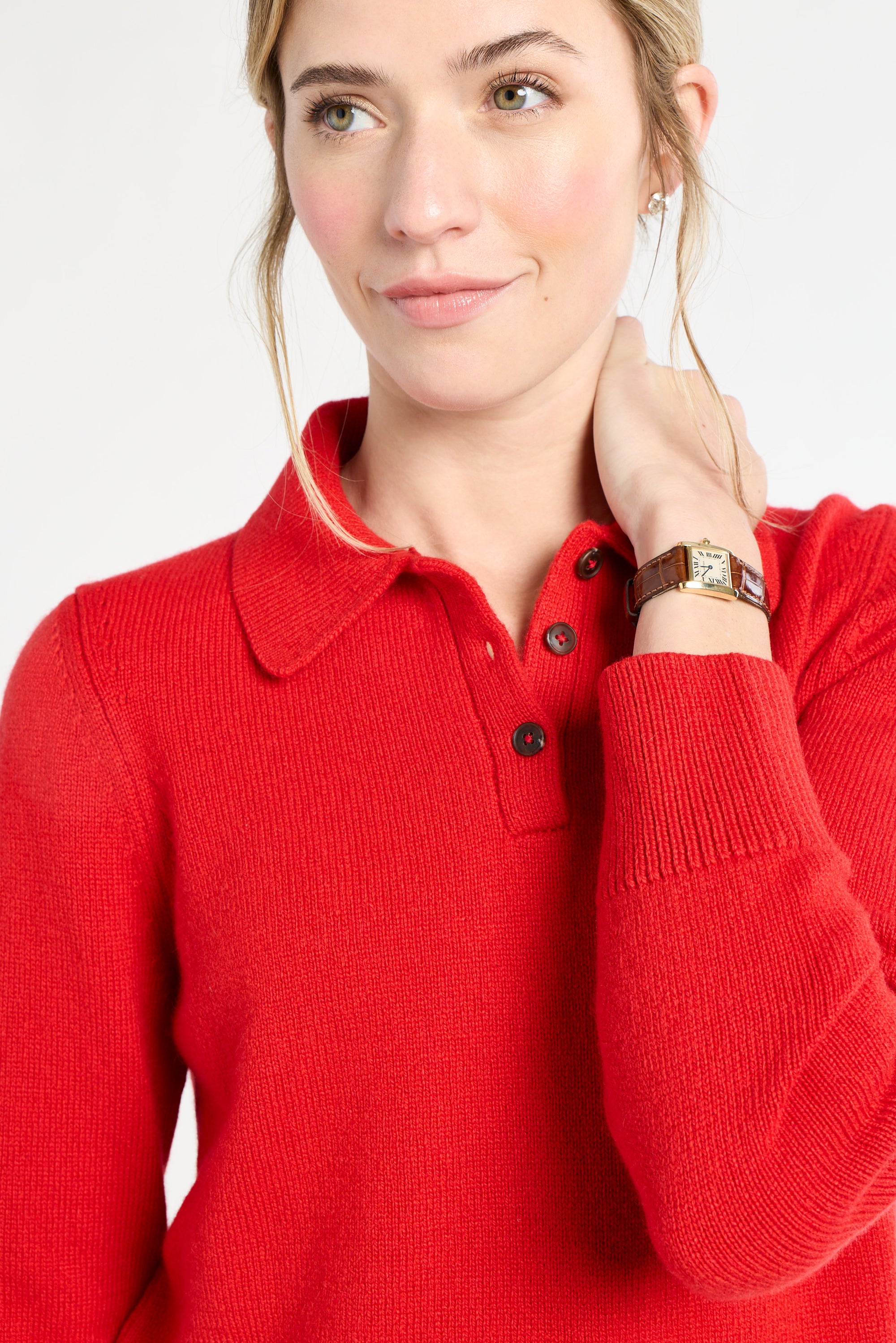 Person wearing a red sweater with a white background