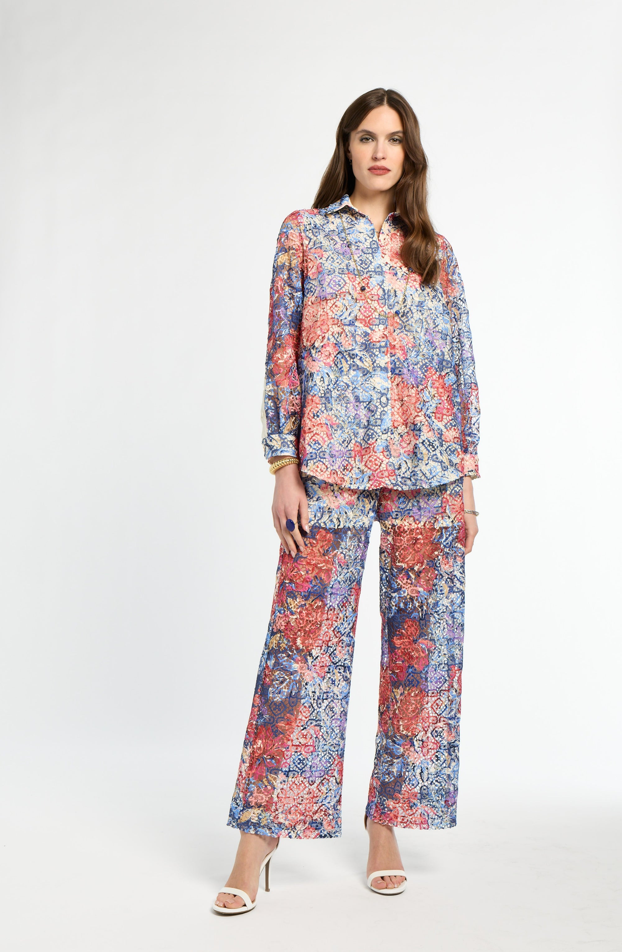 Woman wearing a floral outfit on a white background
