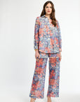 Woman wearing a floral outfit on a white background