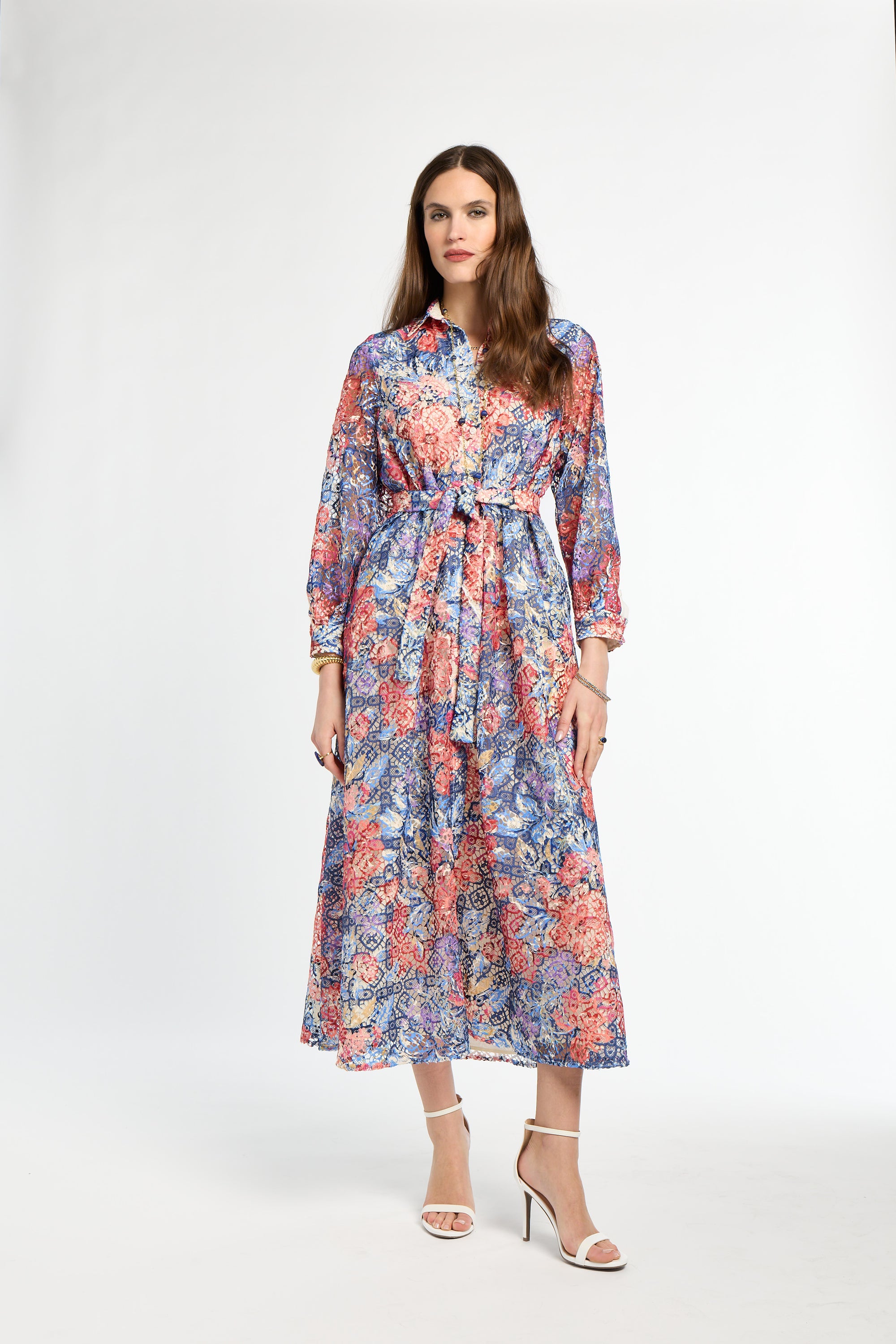 Woman wearing a floral dress on a white background