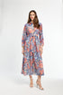 Woman wearing a floral dress on a white background