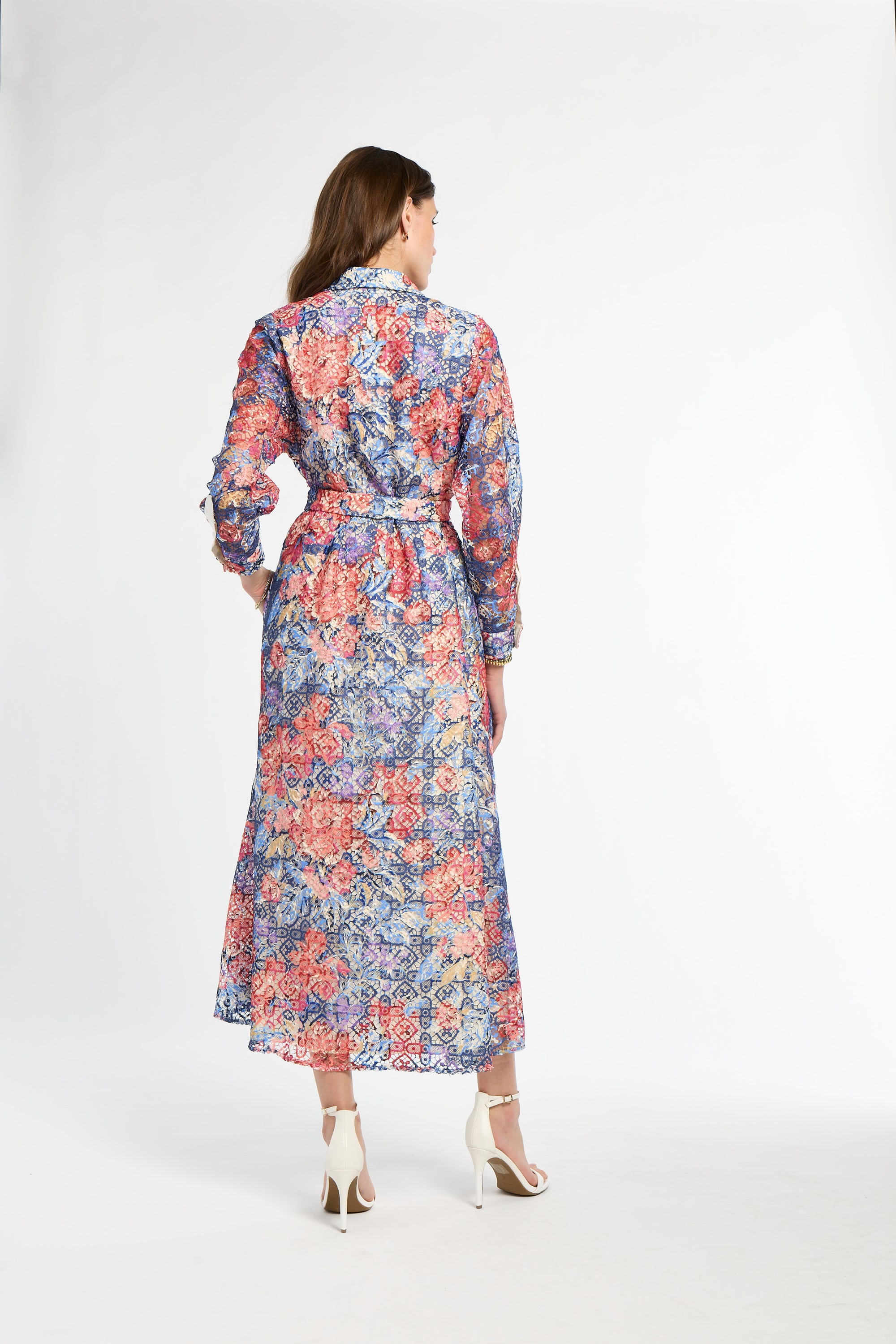 Woman wearing a floral dress on a white background