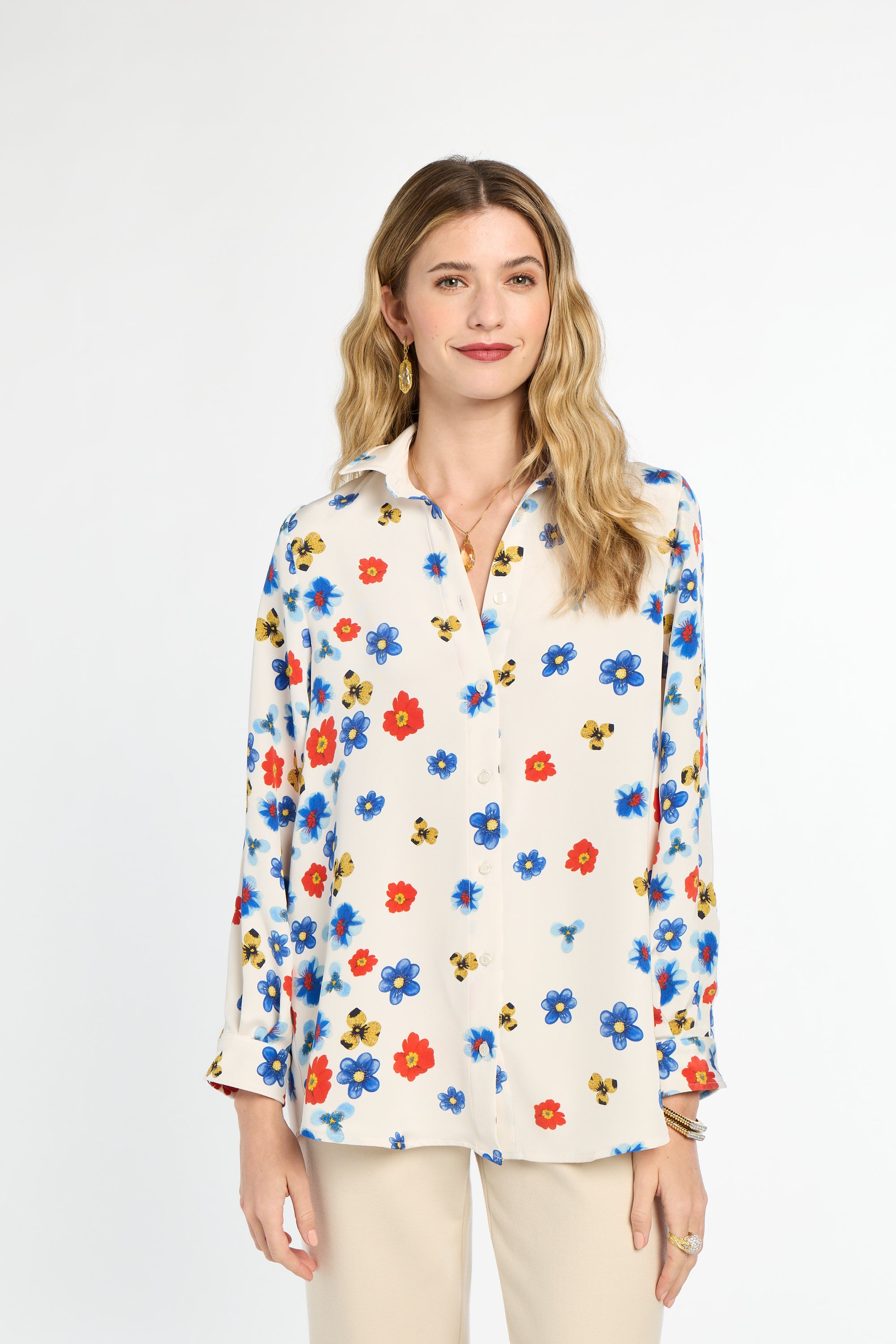 Woman wearing a floral blouse on a white background