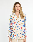 Woman wearing a floral blouse on a white background