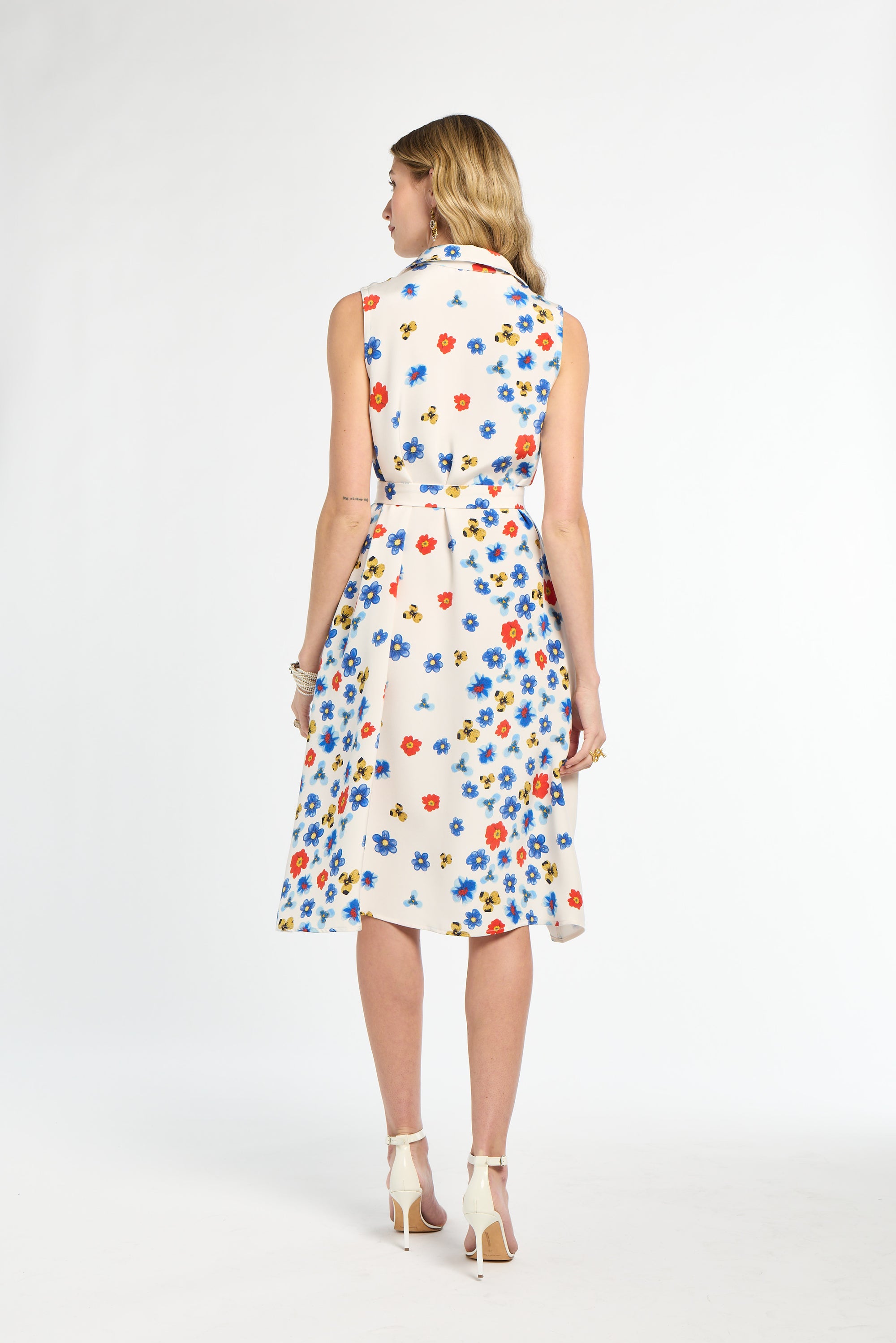 Woman wearing a floral dress on a white background