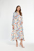 Woman wearing a floral dress on a white background