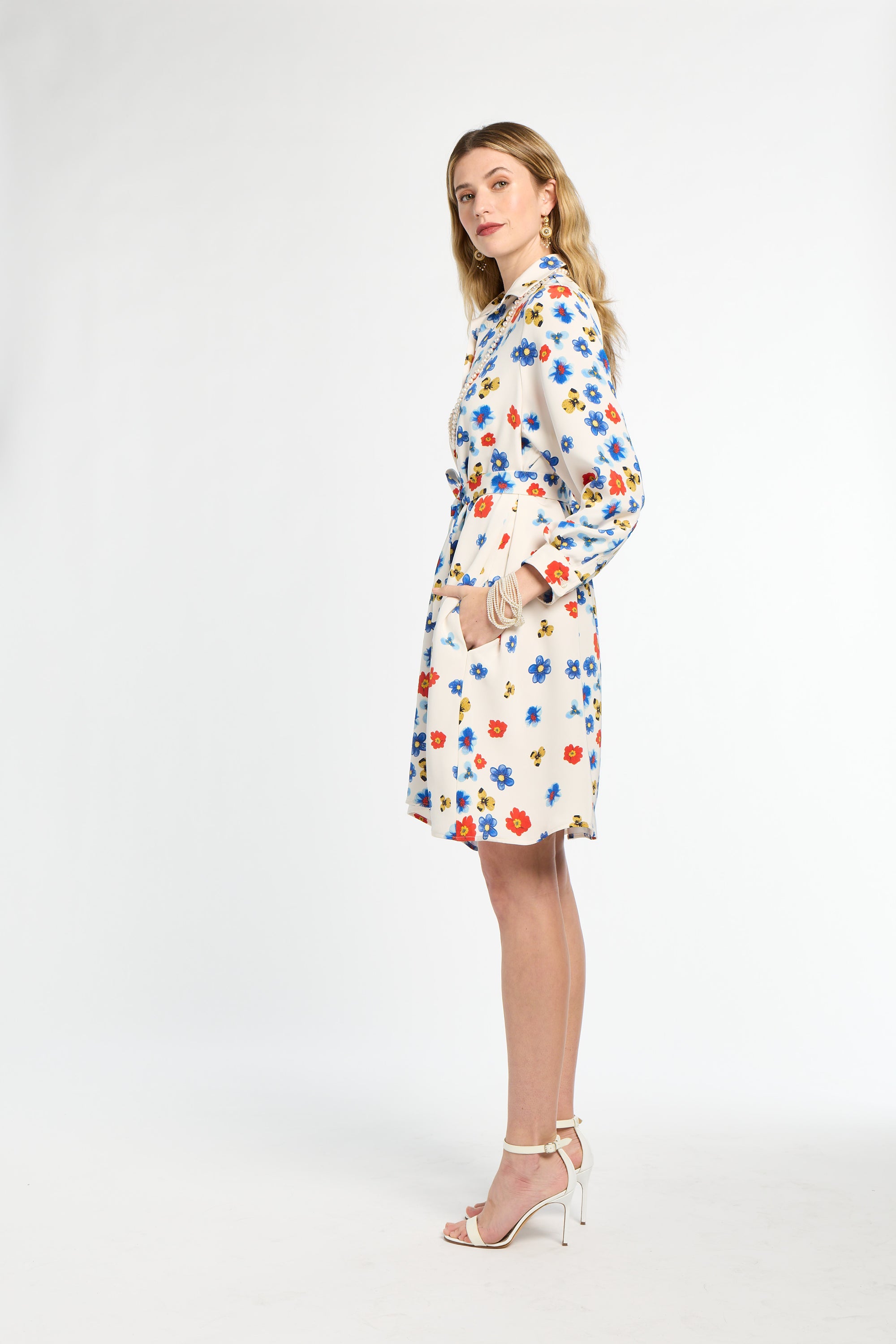 Woman wearing a floral dress on a white background