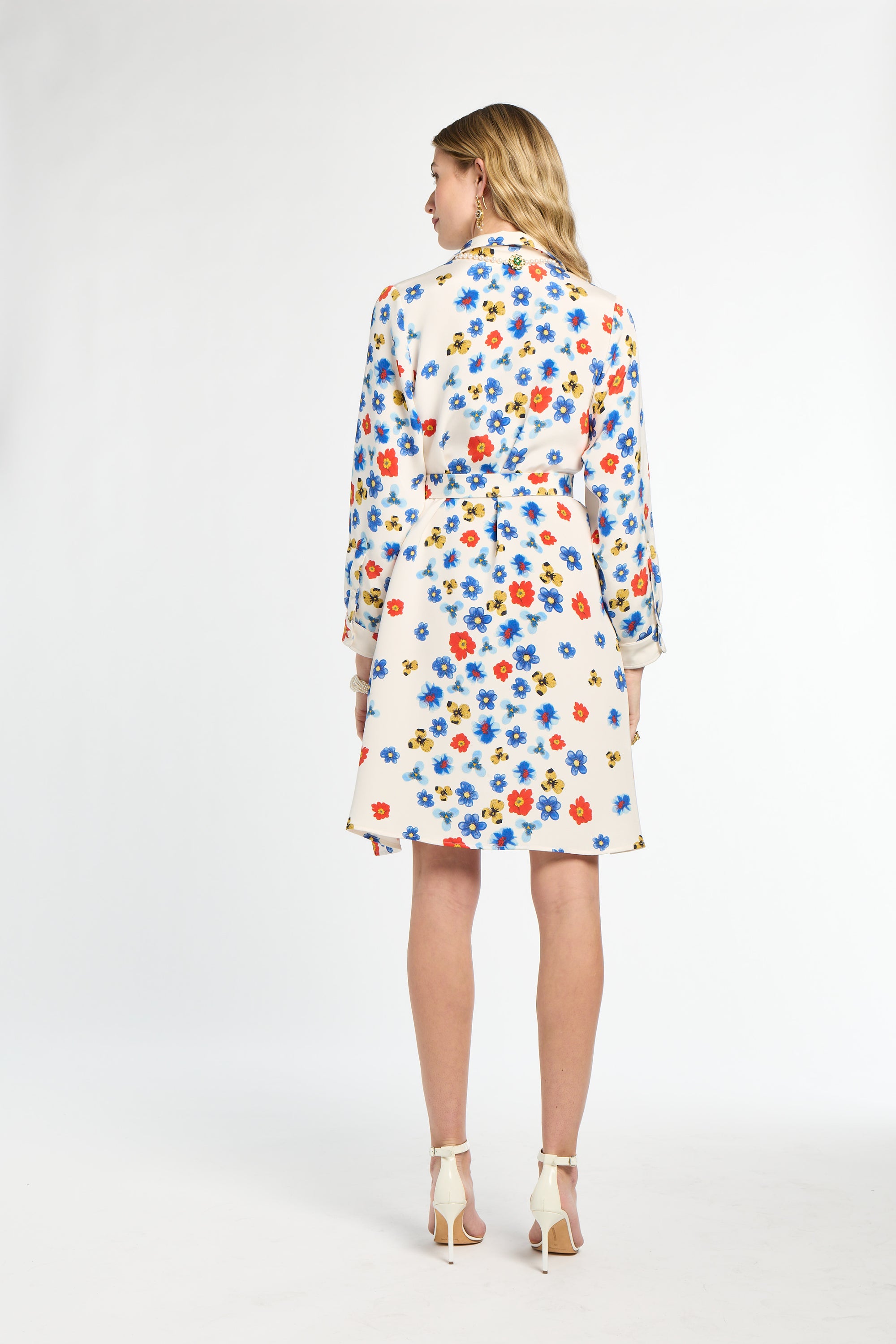 Woman wearing a floral dress on a white background