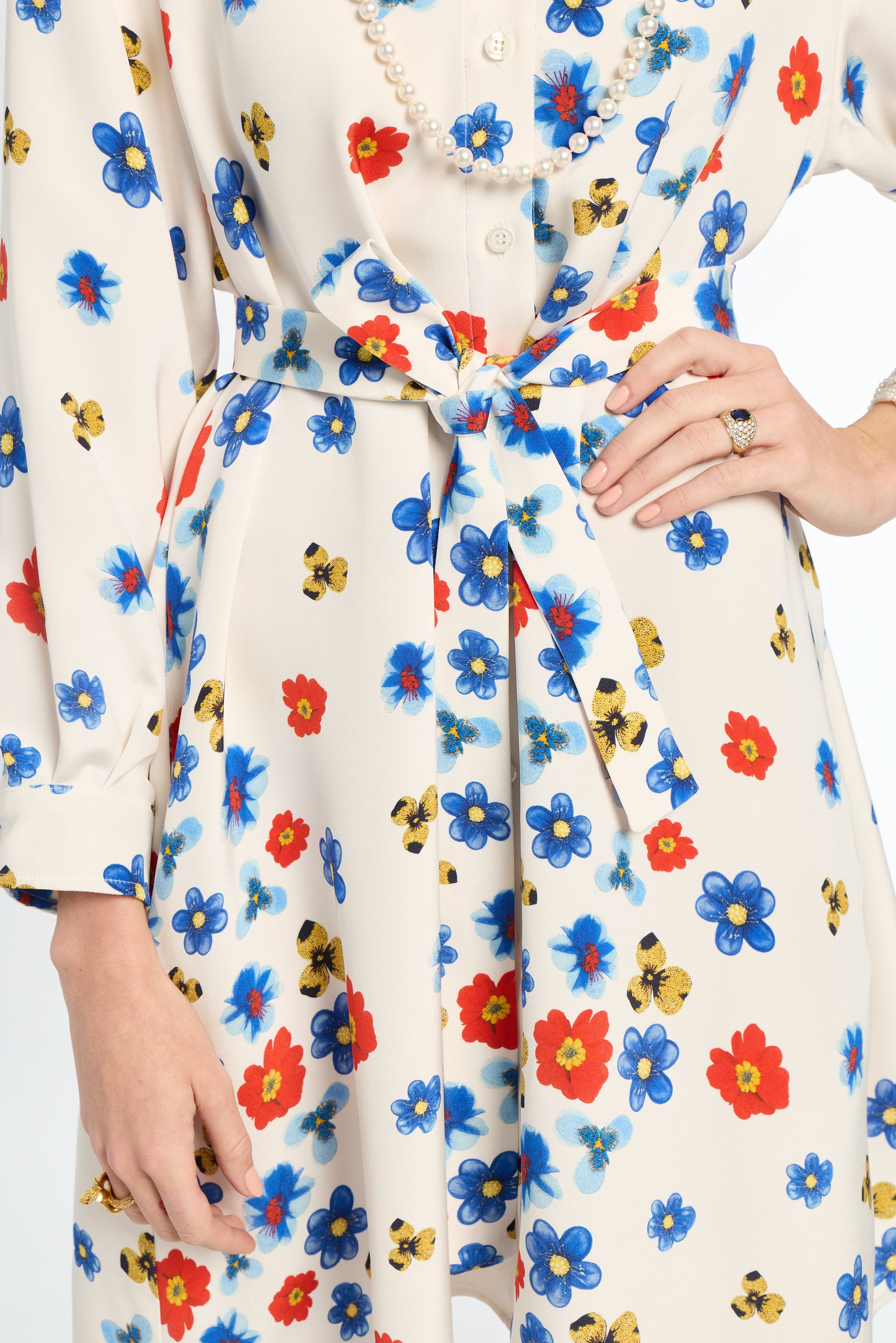 Floral dress with colorful flowers and bees on a white background