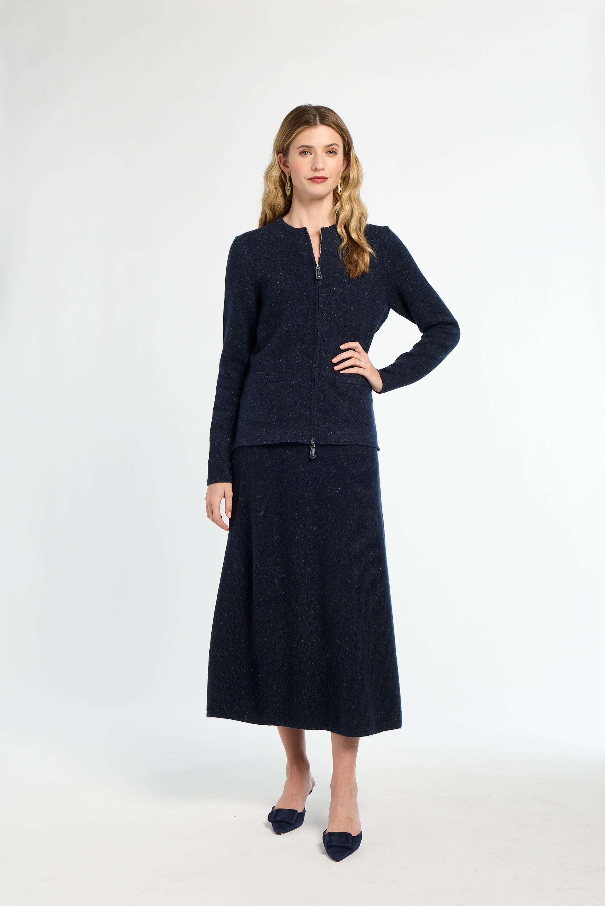 Woman wearing a navy blue suit on a white background