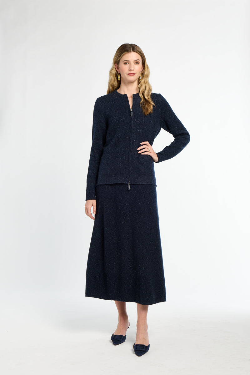 Woman wearing a navy blue suit on a white background