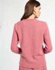 Woman wearing a pink outfit on a white background