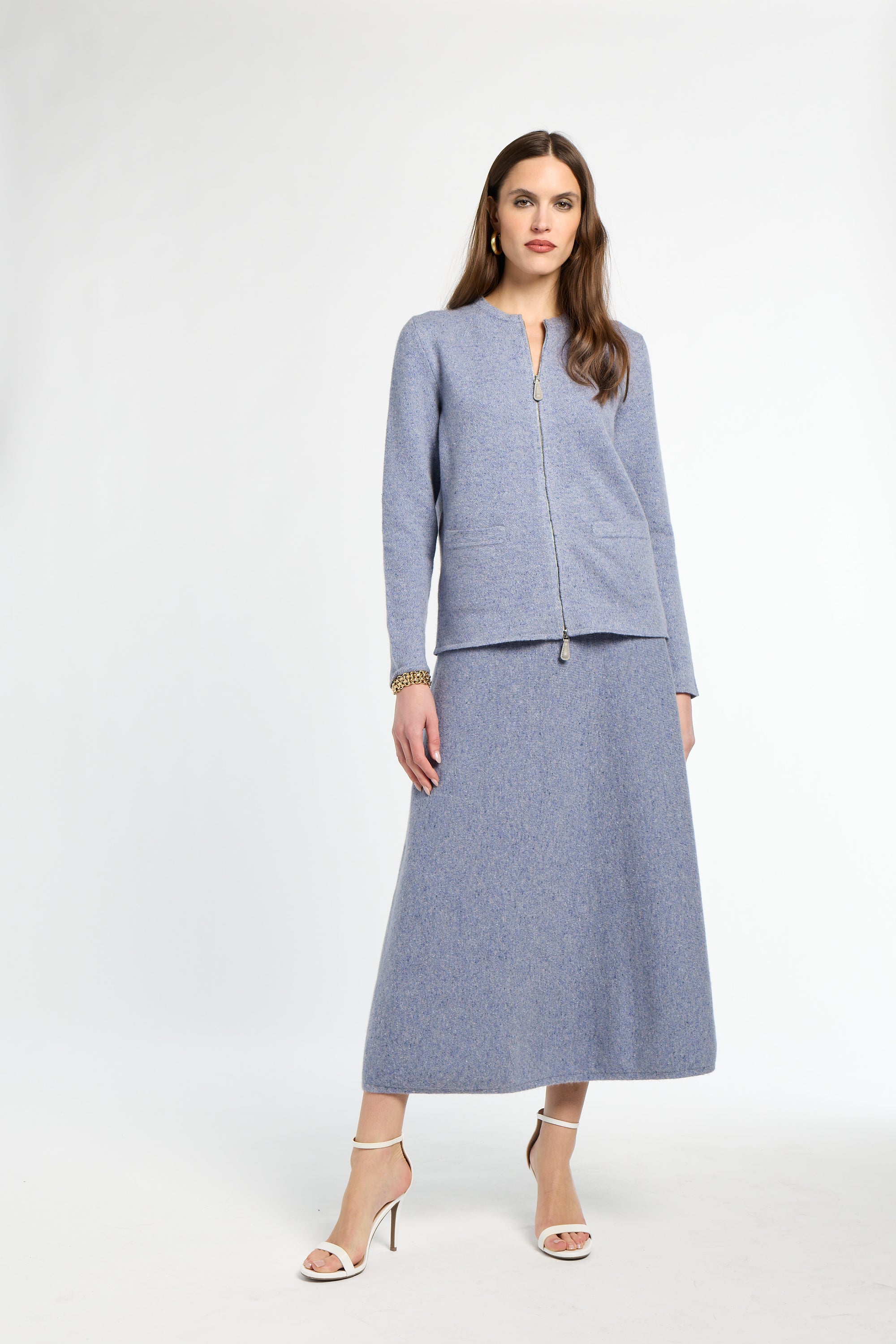 Woman wearing a gray suit on a white background