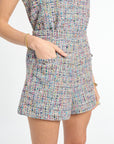 Multicolored tweed romper on a white background