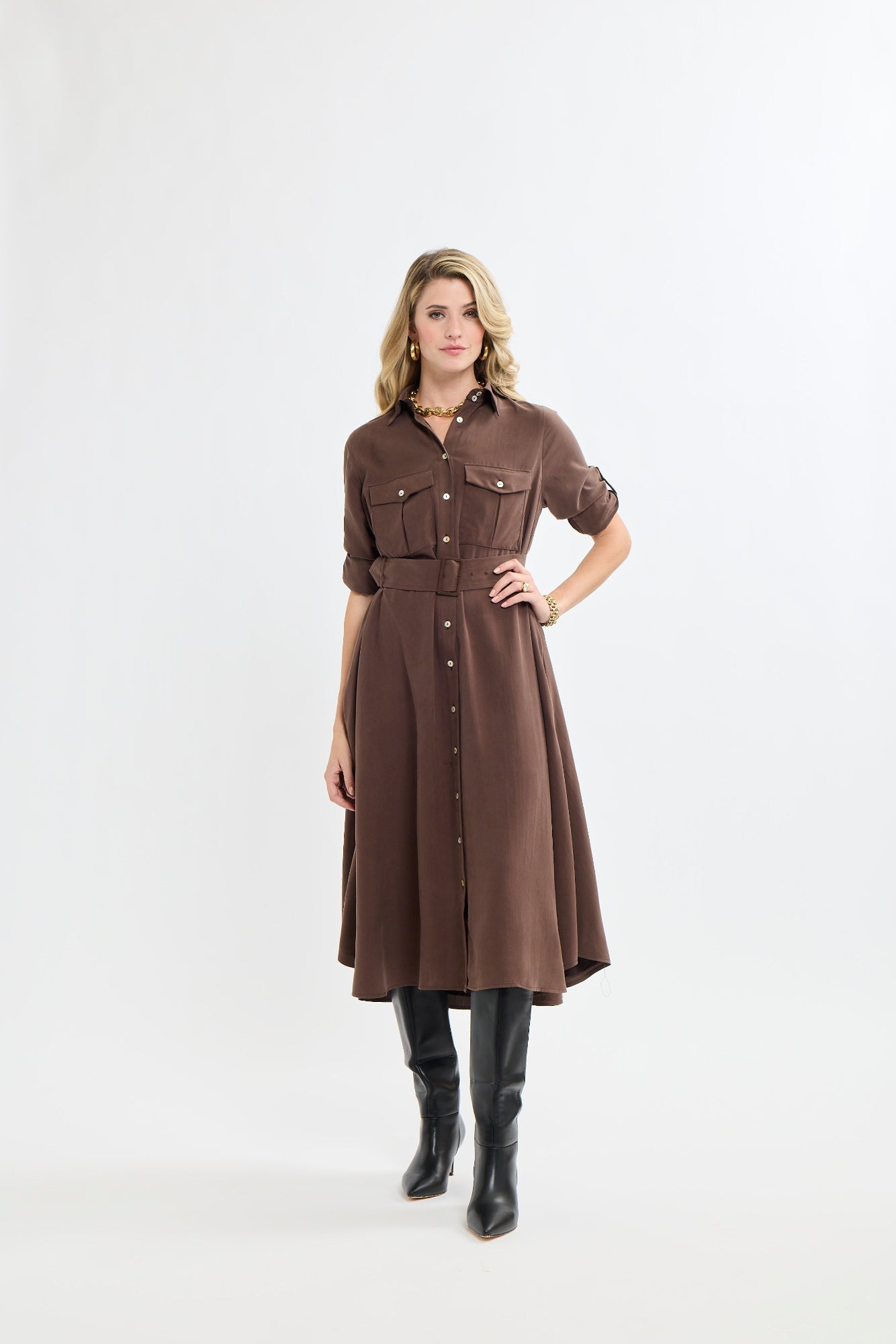 Woman wearing a brown dress with a white background