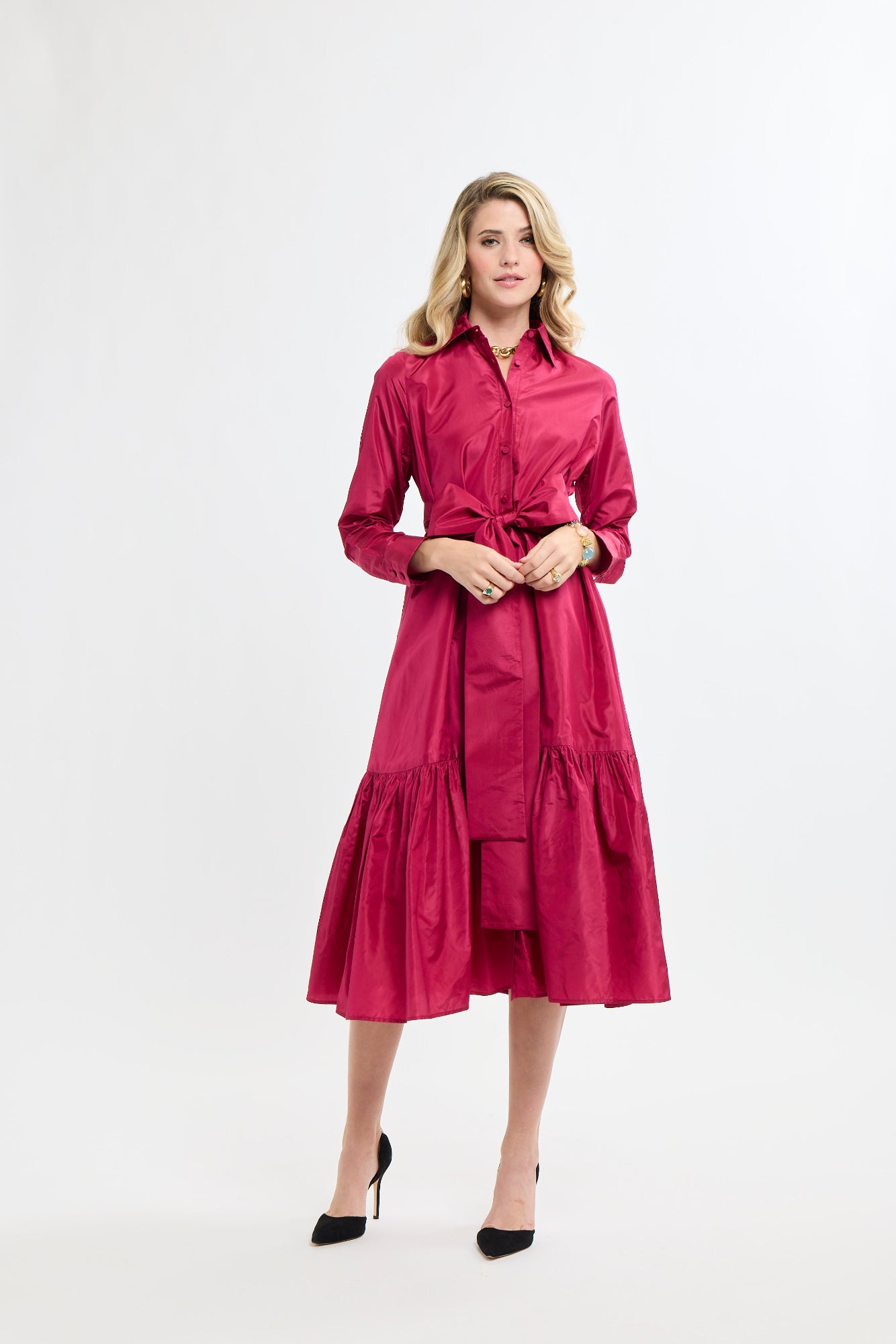 Woman wearing a pink dress on a white background