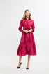 Woman wearing a pink dress on a white background