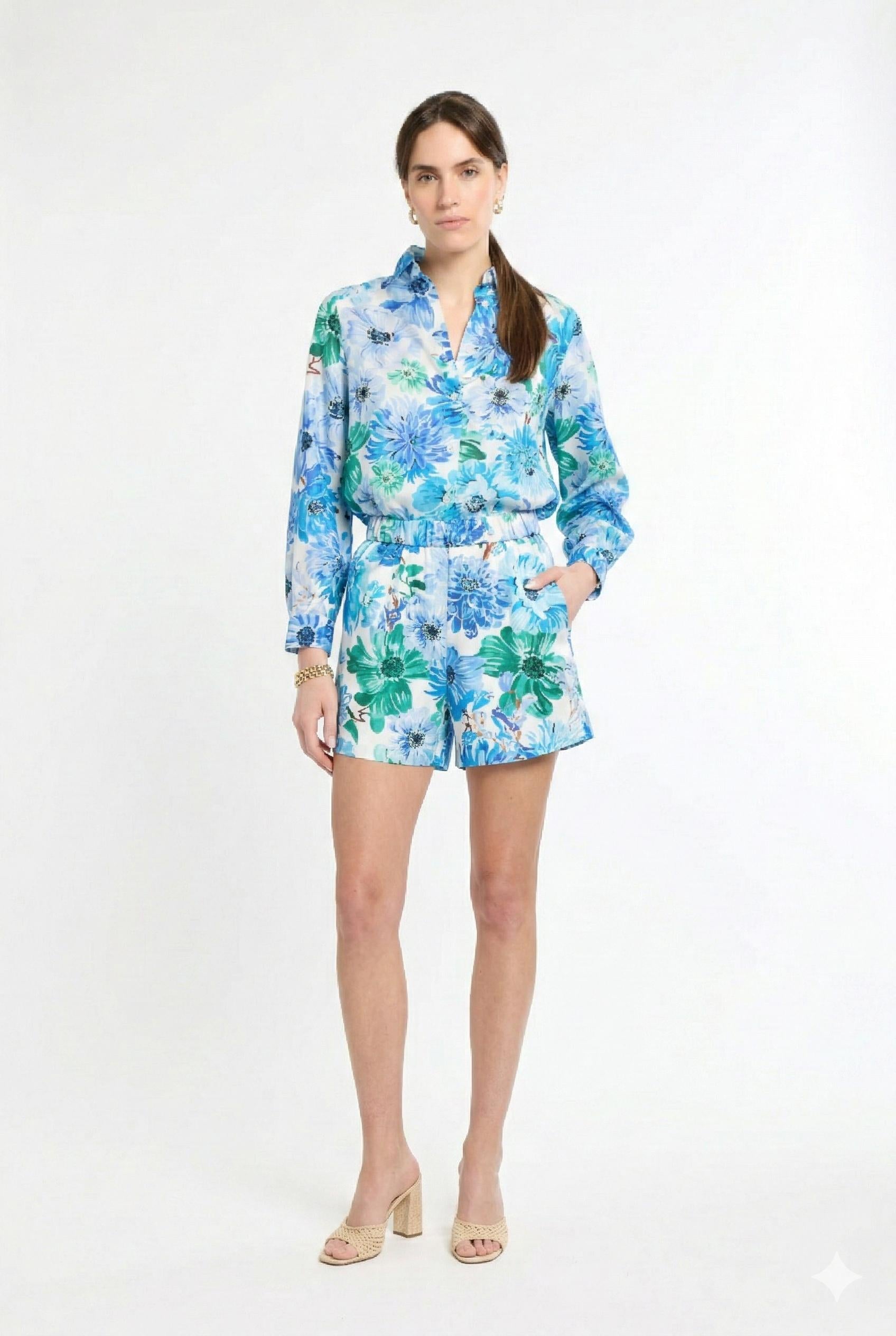 woman wearing matching green and blue floral shirt and short set