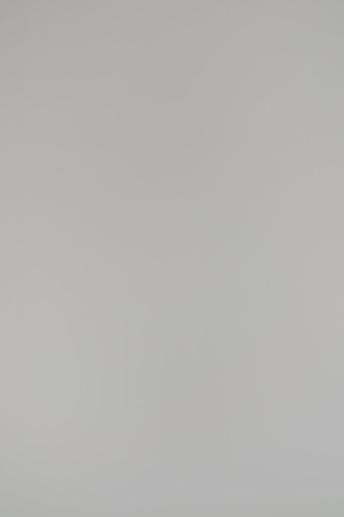 Woman wearing a black blouse on a white background