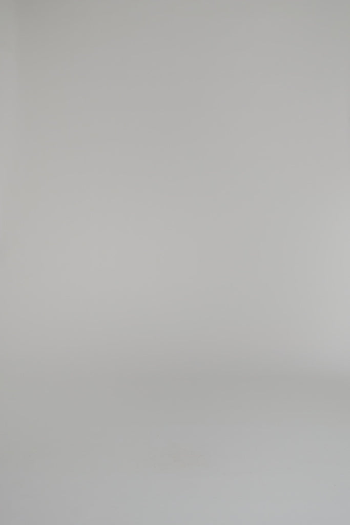 woman modeling black and white design outfit