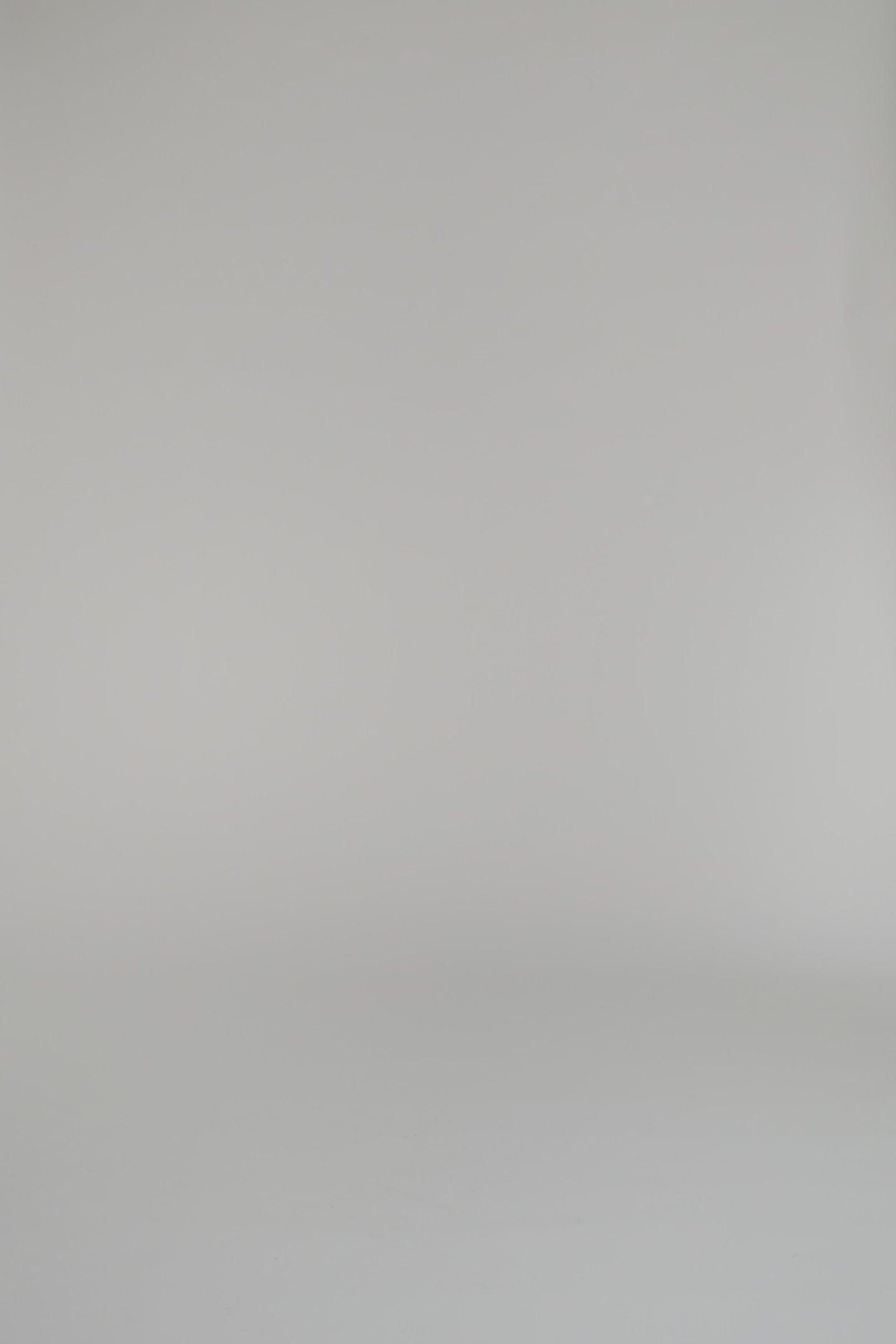 woman modeling blue patterned outfit with nude heels