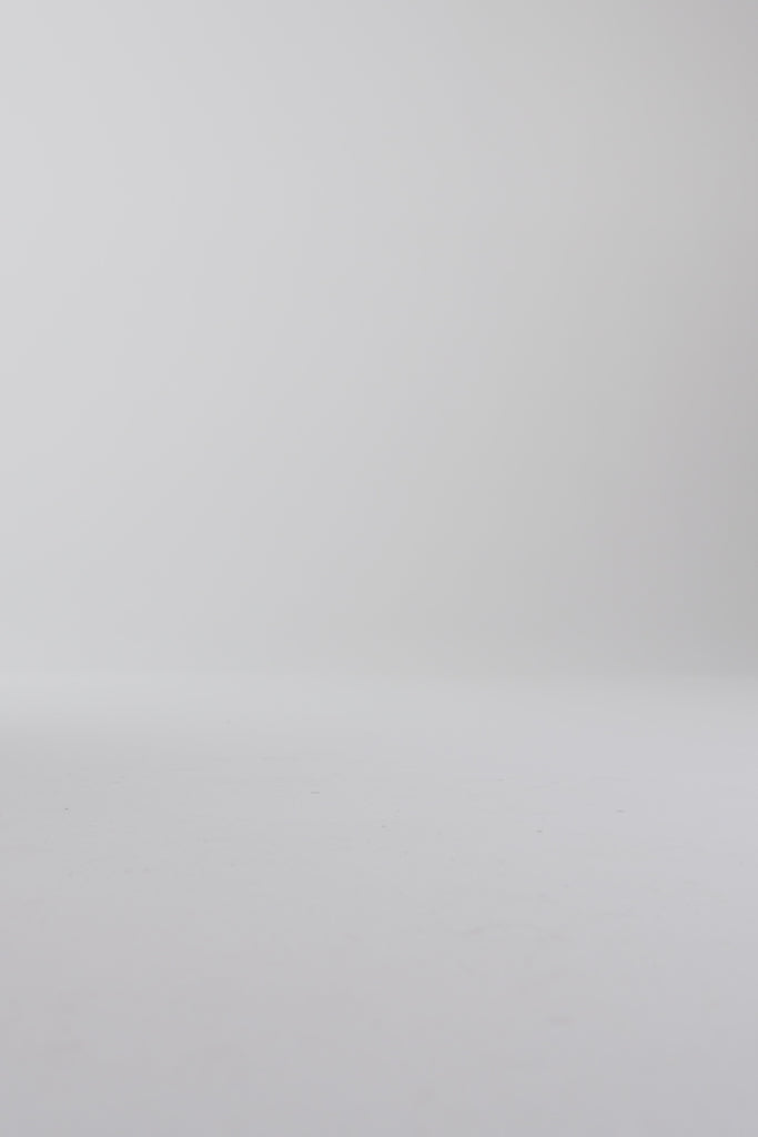 Woman walking in brown oxford shoes on a white backdrop