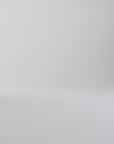 Woman walking in brown oxford shoes on a white backdrop