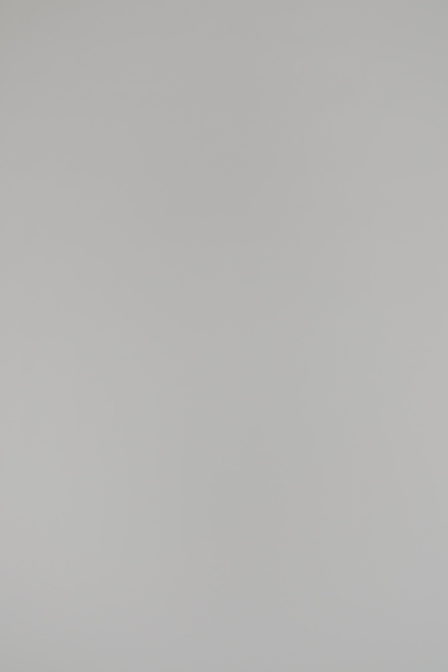 woman wearing a black v-neck cashmere sweater on a white background